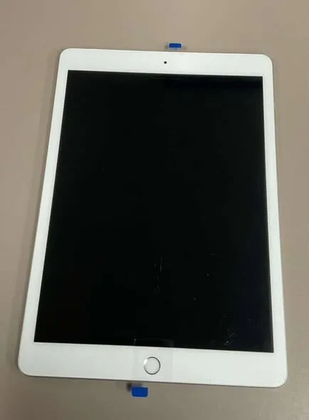 White tablet prepared for repair at the shop